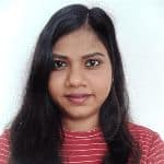 Woman with long dark hair wearing a red and white striped top, facing forward against a plain white background.
